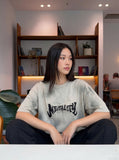 DAXUEN Faded crew neck t-shirt with 'MENTALITY' embroidery — model photo