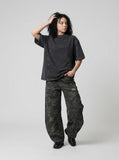 DAXUEN Faded olive green and charcoal grey t-shirt with ribbed texture — model photo