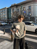 DAXUEN Faded olive green and charcoal grey t-shirt with ribbed texture — model photo