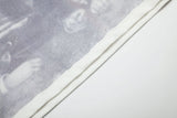 DAXUEN white T-shirt with faded portrait graphic and scribbles