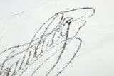 DAXUEN white T-shirt with faded portrait graphic and scribbles
