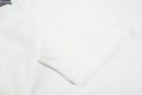 DAXUEN white T-shirt with faded portrait graphic and scribbles