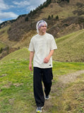 DAXUEN Faded text graphic short-sleeved T-shirt — model photo