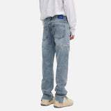 DAXUEN Faded vintage straight-leg denim jeans for men — model photo