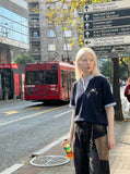 DAXUEN Faux-layered short-sleeved T-shirt with cartoon dog embroidery — model photo