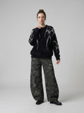 DAXUEN Faux mink texture crew neck sweater with abstract patterns — model photo