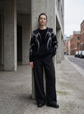 DAXUEN Faux mink texture crew neck sweater with abstract patterns — model photo