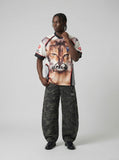 DAXUEN Fierce cat graphic V-neck t-shirt — model photo