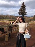 DAXUEN Women's fitted zip-up top with short sleeves — model photo