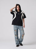 DAXUEN black oversized flame-graphic panel T-shirt — model photo