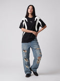 DAXUEN black oversized flame-graphic panel T-shirt — model photo