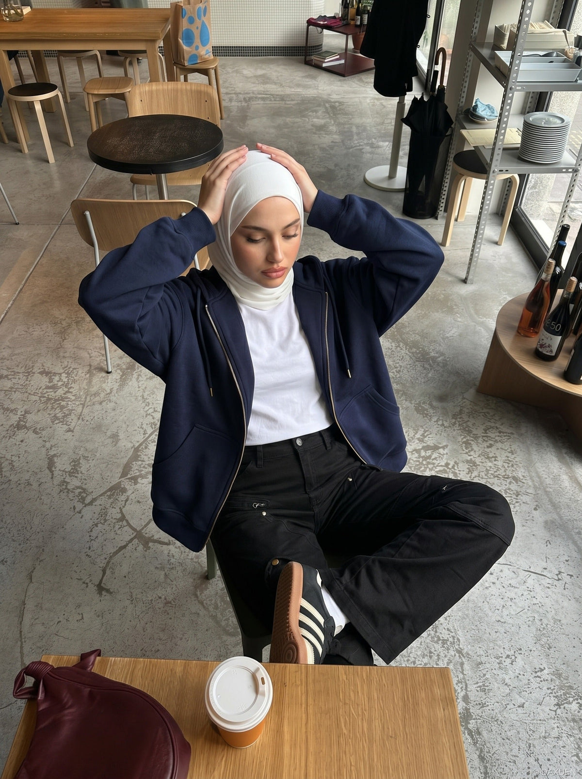 DAXUEN Solid black flared cargo pants — model photo