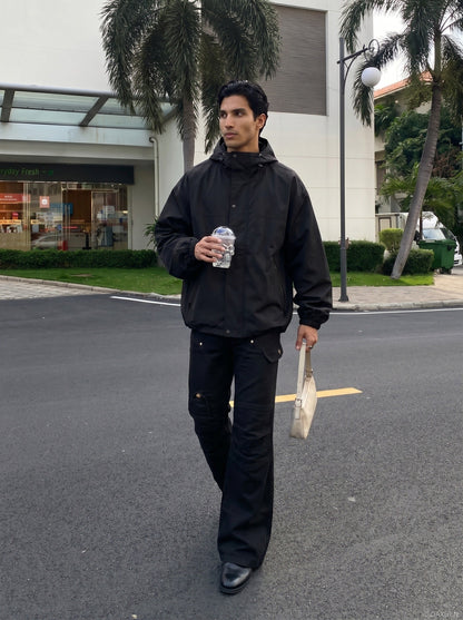 DAXUEN Solid black flared cargo pants — model photo