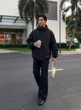 DAXUEN Solid black flared cargo pants — model photo
