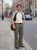 DAXUEN olive green flared cargo pants — model photo