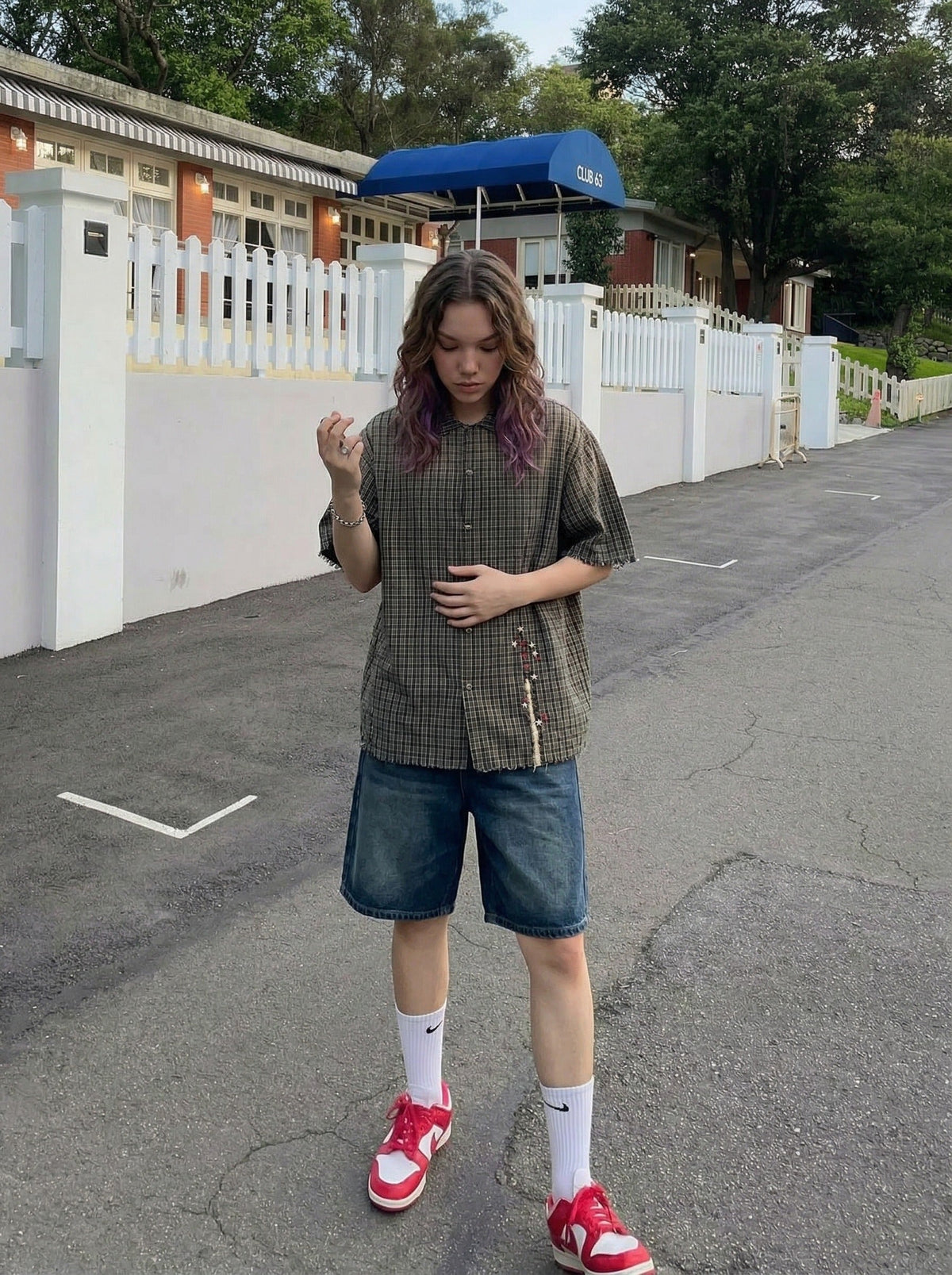 DAXUEN Oversized plaid button-up shirt with frayed edges — model photo