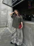 DAXUEN Oversized plaid button-up shirt with frayed edges — model photo