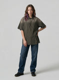 DAXUEN Oversized plaid button-up shirt with frayed edges — model photo