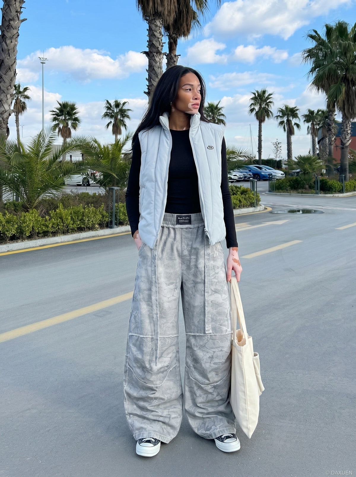 DAXUEN Oversized wide-leg pants with crinkled pattern and embroidery — model photo