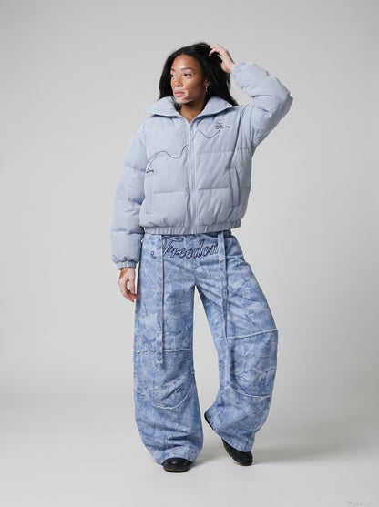 DAXUEN Oversized wide-leg pants with crinkled pattern and embroidery — model photo