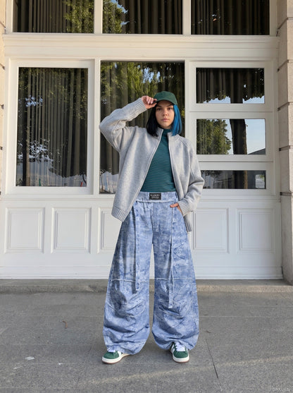 DAXUEN Oversized wide-leg pants with crinkled pattern and embroidery — model photo
