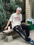 DAXUEN Graphic print t-shirt with casino chips — model photo