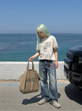 DAXUEN Relaxed-fit graphic t-shirt with stylized text — model photo