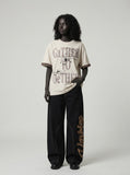 DAXUEN Relaxed-fit graphic t-shirt with stylized text — model photo