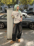 DAXUEN Relaxed-fit graphic t-shirt with stylized text — model photo