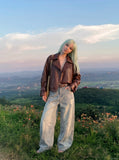 DAXUEN light blue distressed wide-leg jeans with geometric paneling — model photo