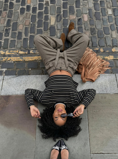 DAXUEN black oversized striped top with geometric embroidery — model photo