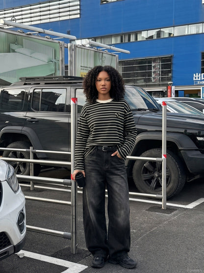 DAXUEN black oversized striped top with geometric embroidery — model photo