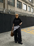 DAXUEN Oversized short-sleeve T-shirt with geometric logo — model photo