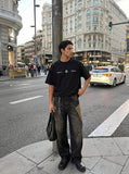 DAXUEN Oversized short-sleeve T-shirt with geometric logo — model photo
