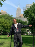 DAXUEN Wide-leg track pants with geometric color-blocked panels — model photo