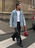 DAXUEN Wide-leg track pants with geometric color-blocked panels — model photo