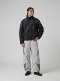 DAXUEN Wide-leg track pants with geometric color-blocked panels — model photo