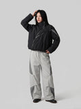 DAXUEN Wide-leg track pants with geometric color-blocked panels — model photo