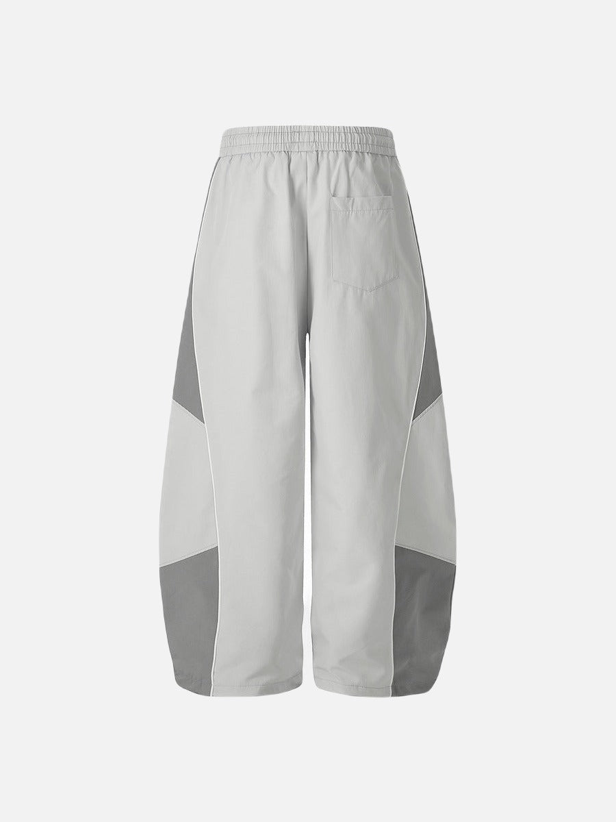 DAXUEN Wide-leg track pants with geometric color-blocked panels