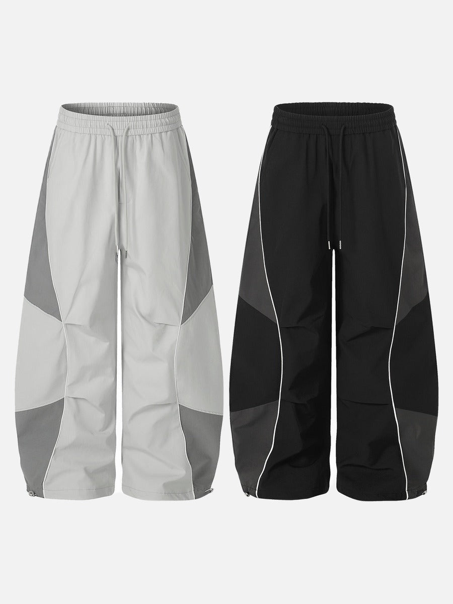 DAXUEN Wide-leg track pants with geometric color-blocked panels