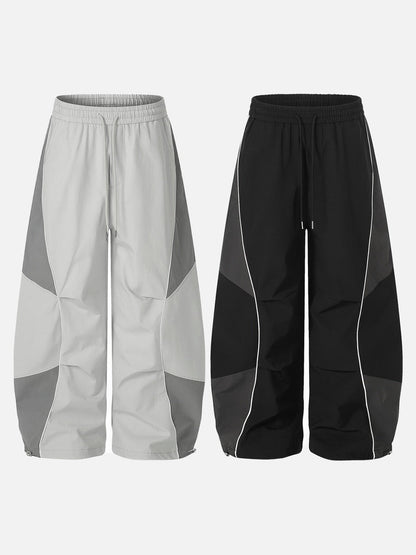 DAXUEN Wide-leg track pants with geometric color-blocked panels