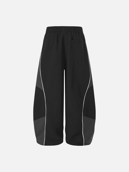 DAXUEN Wide-leg track pants with geometric color-blocked panels