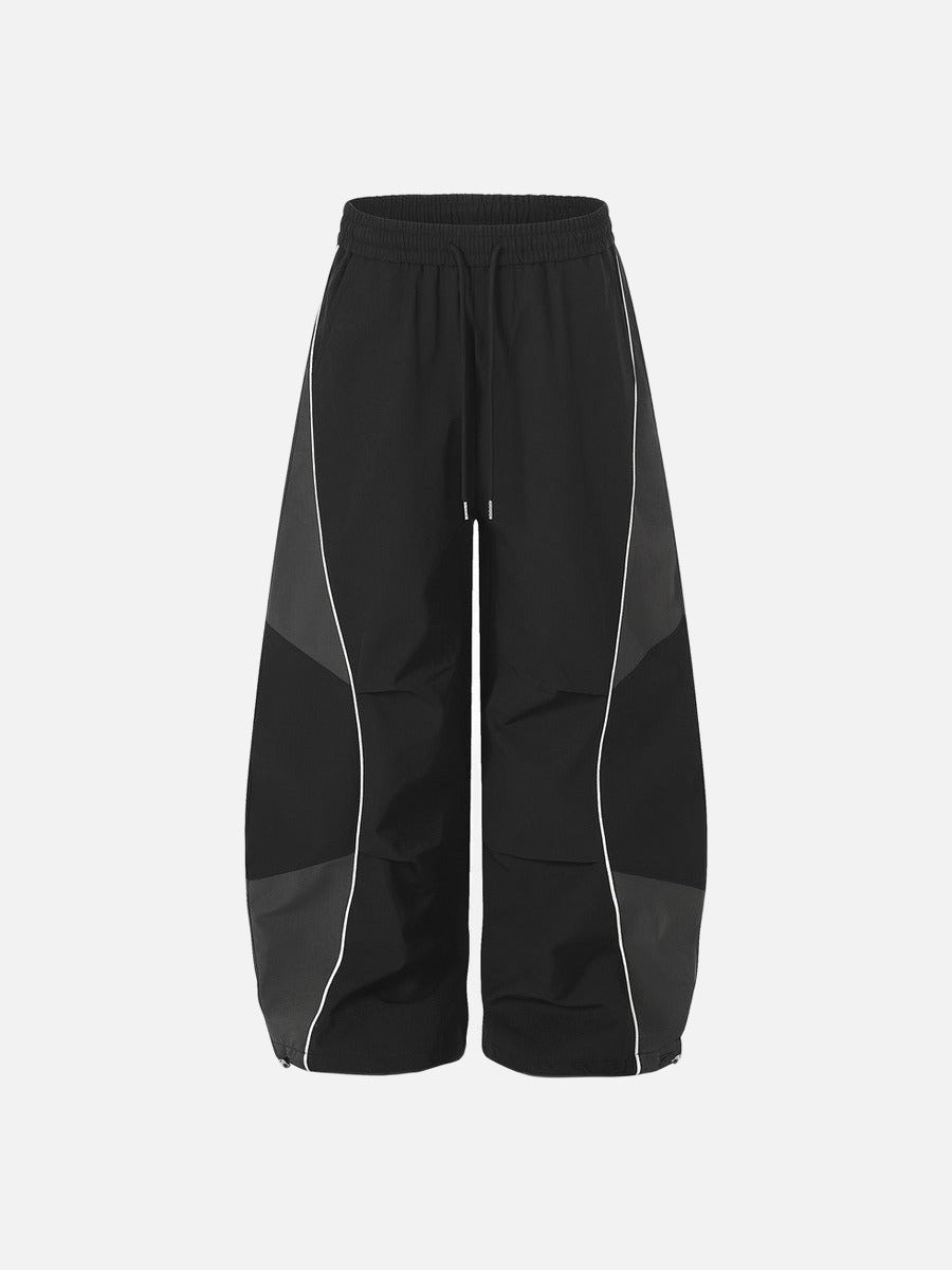 DAXUEN Wide-leg track pants with geometric color-blocked panels
