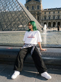 DAXUEN white oversized red geometric 'STAFFPICK' graphic tee — model photo