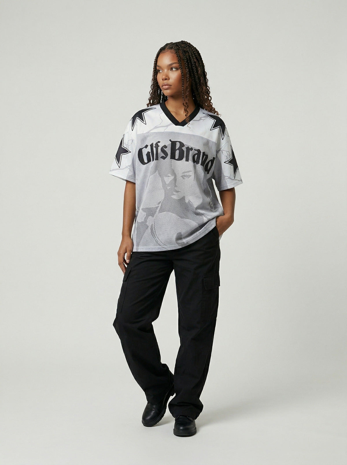 DAXUEN Distressed V-neck short sleeve top with graphic print — model photo