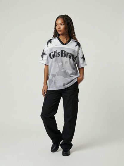 DAXUEN Distressed V-neck short sleeve top with graphic print — model photo