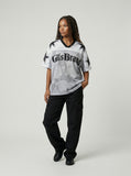 DAXUEN Distressed V-neck short sleeve top with graphic print — model photo