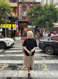 DAXUEN Glitchy text graphic short-sleeved T-shirt — model photo