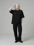 DAXUEN Glitchy text graphic short-sleeved T-shirt — model photo