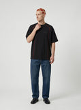 DAXUEN Glitchy text graphic short-sleeved T-shirt — model photo